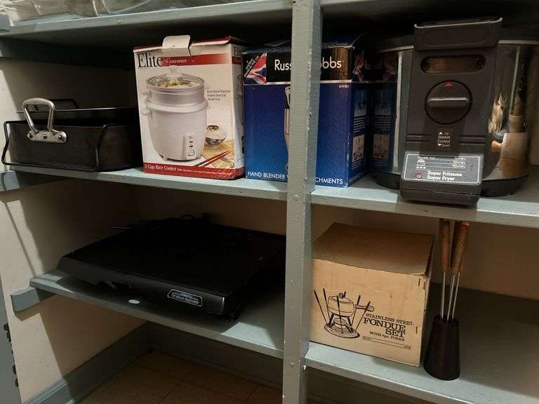 Grouping of small kitchen appliances, electric griddle, fondue set, breadmaker and more image