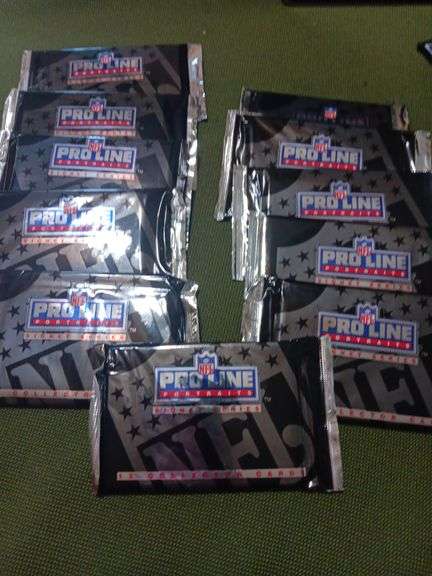 11.
Packages of unopened Pro Line football cards .12 cards in each pack..1991 image