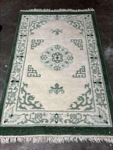 42-1/2 x 66-1/2 area rug in hues of green and white…..does have a few blemishes image