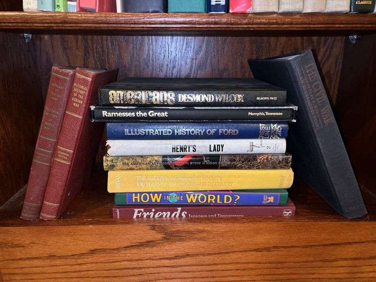 3 shelves of books of various titles and by variety of authors…..both paperback and hardback