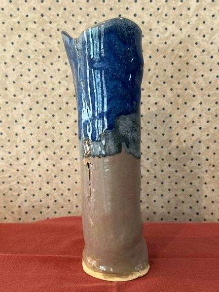 Beautifully designed and handcrafted Owl Eyes Pottery glaze drip vase (has appearance of dripping candle wax)…..9-1/2” tall….Owl Eyes Pottery are pieces designed by the seller and are food safe….has (1) firing defect