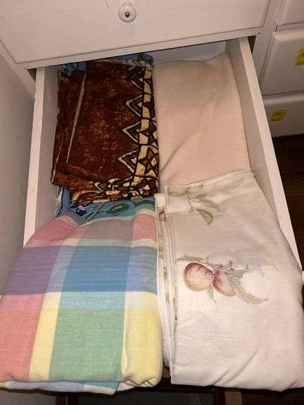 Drawer containing various size table linens…..most are freshly cleaned image