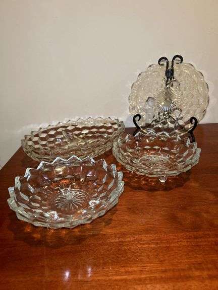 Grouping of (4) Fostoria American Cubist pieces…..(2) 6-1/4”D footed bowls, (1) 7-3/4” footed plate and (2) 10” divided serving piece (has 3 tiny chips around rim)￼