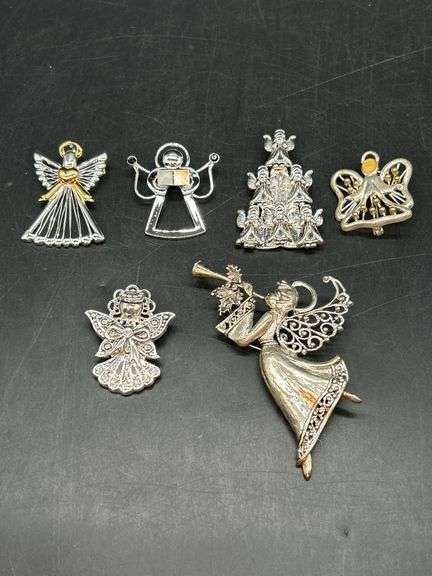 Beautiful grouping of angel brooches image