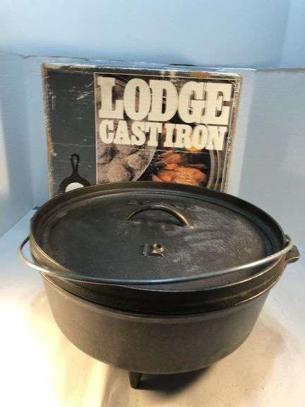 Lodge #12 12” 6 quart outdoor Dutch oven with flanged lid and integral legs. Stored in original box. Possibly new.