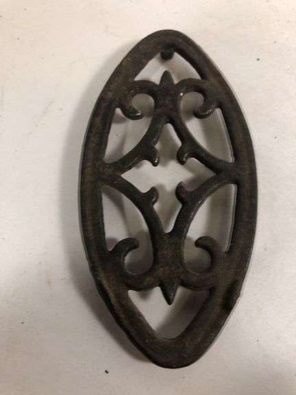Antique child SAD iron footed trivet. Black. 3.5 x 2”