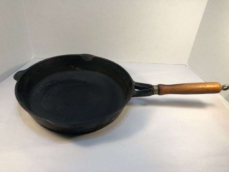 10” diameter 2 spout skillet with wooden handle. Made in Taiwan.