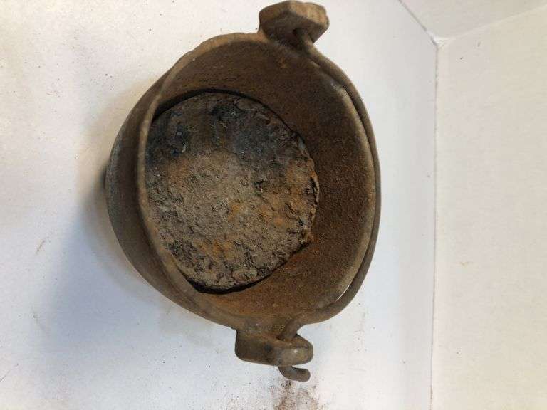 Antique smelting pot. 5” diameter. Plus round block of metal.