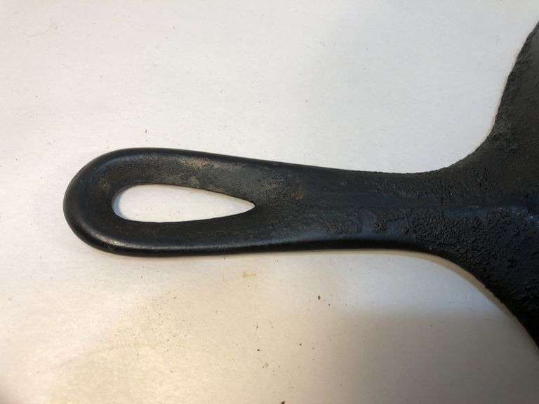 Unmarked #8  10” diameter 2 spout skillet. No spin, no wobble.