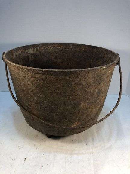 Antique gate marked 19th-century Louisiana cast iron sugar kettle. These large, spherical cast iron kettles were primarily used in the production of sugar on plantations in the American South, especially in Louisiana where sugarcane cultivation thrivedMarked 8 MG. 10” diameter. 8” H. image