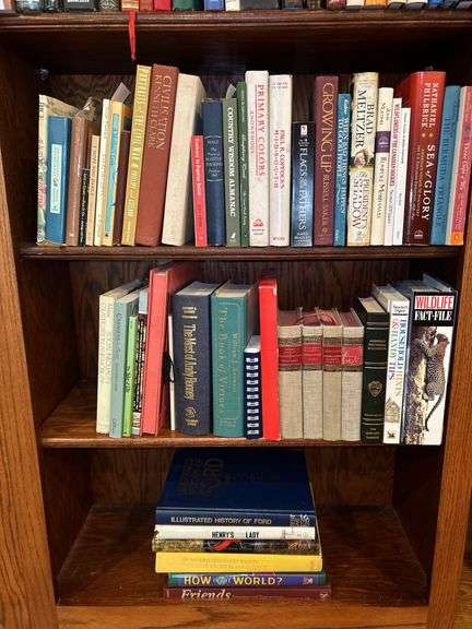 3 shelves of books of various titles and by variety of authors…..both paperback and hardback image