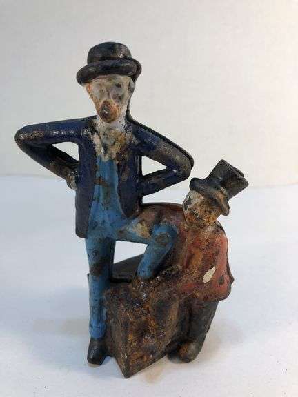 Antique cast iron Mutt and Jeff still piggy bank. 3 1/2” W x 5 1/4” H x 2” D. image