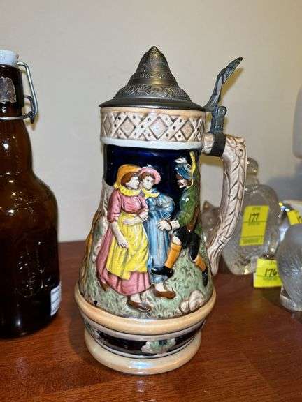 Nice selection of home decor items…..stein on right is musical, football boy is by Danbury Mint, owl pitcher was hand painted in Italy