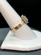 14K yellow gold diamond ring with solid center diamond surrounded by 14 smaller diamonds…..total carat weight is approximately 2.75 carats…..NO APPRAISAL OR PAPERWORK IS INCLUDED…..size 8-3/4