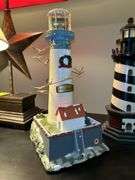 Nice selection of lighthouses made from various materials…..far left is musical (needs batteries, far right is a bank…..heights range from approx. 12-1/2 to 13-1/2” tall