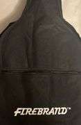 Firebrand Junior Acoustic guitar in case with shoulder carry strap. Received as a gift and never touched so brand new.