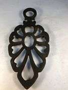 Vintage Wilton cast iron trivet. 8 x 4”.