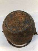 Antique smelting pot. 5” diameter. Plus round block of metal.