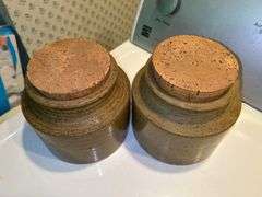 Pair of cork lid jars from Fitz & Floyd…..6”D x 6” tall