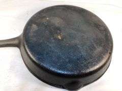 Vintage cast iron skillet with lid. 2 spout. 10” diameter. No spin, no wobble. No markings except an A in the lid.