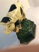 Vintage pair of cast iron black and white spotted pig book ends/door stops. 5 1/2” W x 5” H x 2”D.