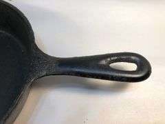 Unmarked 2 spout 8” diameter skillet. No spin, no wobble.
