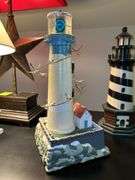 Nice selection of lighthouses made from various materials…..far left is musical (needs batteries, far right is a bank…..heights range from approx. 12-1/2 to 13-1/2” tall