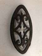 Antique child SAD iron footed trivet. Black. 3.5 x 2”