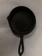 1800s gate marked Lodge #7 pointy handle 4” skillet with single spout and heat ring.