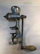 Antique Ward’s silver metal meat grinder. Wooden handle hand crank. Clamp for attaching to  surface for grinding meat. In excellent condition