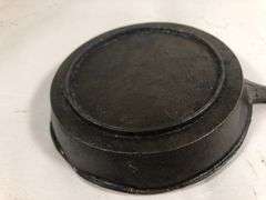 1800s gate marked Lodge #7 pointy handle 4” skillet with single spout and heat ring.