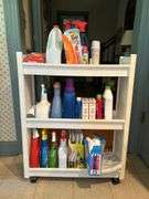 Slide-in laundry caddy and contents…..24-3/4 x 8-1/4 x 31-1/2 tall…..all contents are partial boxes and bottles