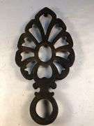 Vintage Wilton cast iron trivet. 8 x 4”.