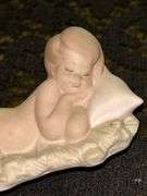 LLADRO Baby Jesus Sleeping on a Bed of Hay Bisque Porcelain Figurine (#4670)…..3-3/4” long x 2” tall…..part of the Children’s Nativity Series