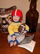 Nice selection of home decor items…..stein on right is musical, football boy is by Danbury Mint, owl pitcher was hand painted in Italy