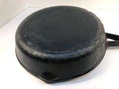 10” diameter 2 spout skillet with wooden handle. Made in Taiwan.