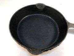 Unmarked 2 spout 8” diameter skillet. No spin, no wobble.