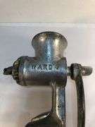 Antique Ward’s silver metal meat grinder. Wooden handle hand crank. Clamp for attaching to  surface for grinding meat. In excellent condition
