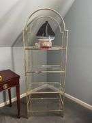 Gold-tone metal shelving unit with 4 glass shelves…..24-1/2 x 14-1/4 x 67-1/2 tall…..OTHER CONTENTS NOT INCLUDED