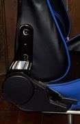 Blue and black rolling high back racing gaming chair, adjustable with foot rest.