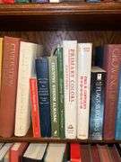 3 shelves of books of various titles and by variety of authors…..both paperback and hardback