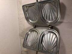S.E. F.A.M.A. Aluminum French seashell sandwich/toast press. Made in France. Press 8 x 5” excluding handle.