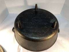 Lodge #12 12” 6 quart outdoor Dutch oven with flanged lid and integral legs. Stored in original box. Possibly new.