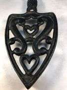 Vintage SAD iron rest/ trivet cast iron, scroll design. Footed.  8 x 3.5”