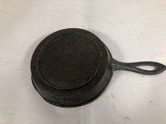 1800s gate marked Lodge #7 pointy handle 4” skillet with single spout and heat ring.
