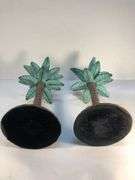 Unusual vintage pair of cast iron palm tree candle holders. Green and brown. 7 3/4” H. Base 4”W.