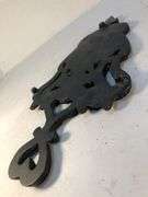 J.Z.H. 1948 cast iron Sunburst trivet. Black. Footed. 9 x 5”