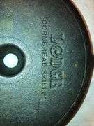 Lodge 9” diameter cornbread skillet.  USA D2 8CB