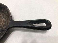 6 1/2” #2  3 notch skillet with heat ring and 2 spouts. Rounded interior surface. Made in Korea.