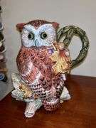 (2) very nice owl home decor items…..left is a pitcher by Fitz & Floyd and stands 8-3/4” tall (1 tiny chip on back log)…..right is an Opa’s Haus Inc. Edition owl themed stein  from The American Wildlife Stein Series (9” tall)